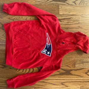 Boys Red NFL pull-over hoodie.